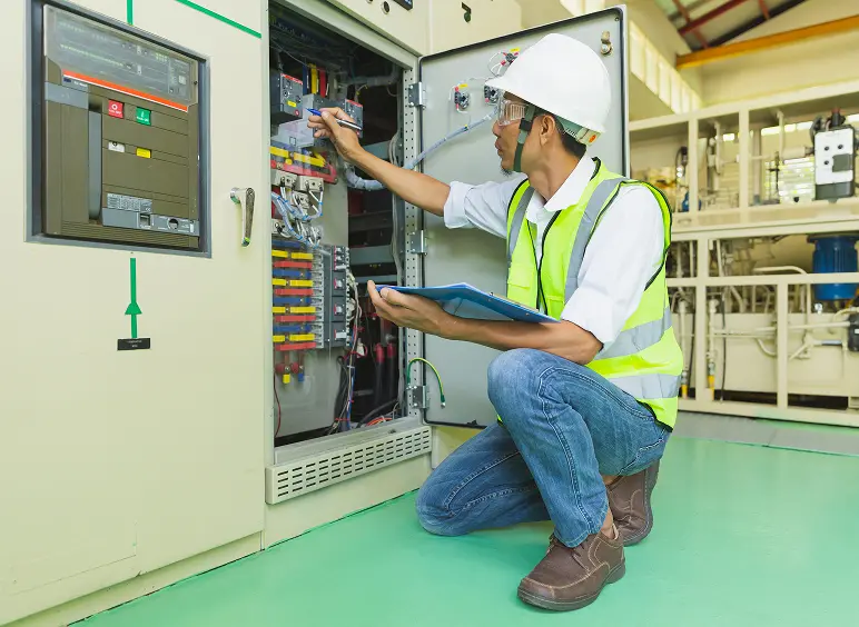 Engineer inspecting electrical panel
